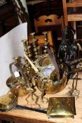 Collection of mostly antique brassware including candlesticks, jam pans,