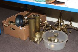 Collection of brassware including light fitting, table lamp, shell cases, candlesticks,