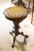 Victorian walnut inlaid sewing table with chess board top raised on carved tripod base