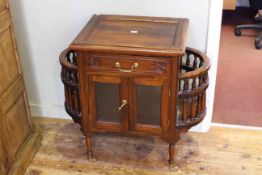 Mahogany finish serving cabinet having frieze drawer above glazed door cabinet and side wine
