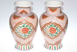 Pair of large Chinese vases decorated in iron red and green, six character marks to base,