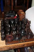 Collection of ebony elephants, bamboo vases, vase stands,