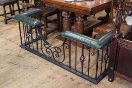 Good quality wrought iron club fender with green leather seats,