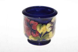 Moorcroft Pottery jardiniere decorated with hibiscus on blue ground