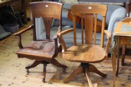 Two early 20th Century swivel office desk armchairs