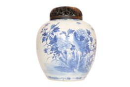 A CHINESE BLUE AND WHITE GINGER JAR, painted with chrysanthemums, birds and insects,