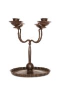 A CONTINENTAL WROUGHT-METAL FOUR BRANCH CANDELABRUM, c.