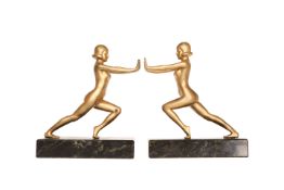 A PAIR OF ART DECO FIGURAL BOOKENDS, each modelled as a female,