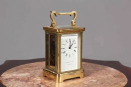 A BRASS CASED CARRIAGE CLOCK, SIGNED GARRARD & CO., with Roman numerals. 11.5cm excluding handle.