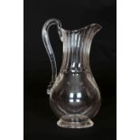 A LATE 18th CENTURY GLASS EWER, with long panelled neck, loop handle and baluster body.