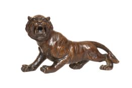 A JAPANESE BRONZE MODEL OF A PROWLING TIGER, MEIJI PERIOD, with open snarling mouth.