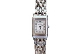 A LADY'S STAINLESS STEEL JAEGER-LECOULTRE REVERSO BRACELET WATCH, with silvered dial, no.