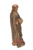 A CARVED AND PAINTED WOODEN FIGURE OF ST.