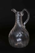 A WRYTHEN GLASS EWER, c. 1800, of baluster form, with loop handle.