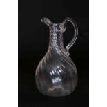 A WRYTHEN GLASS EWER, c. 1800, of baluster form, with loop handle.