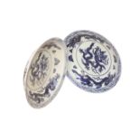 A NEAR PAIR OF CHINESE BLUE AND WHITE PORCELAIN DISHES, circular,