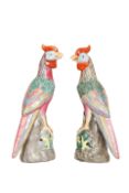 A PAIR OF CHINESE PORCELAIN MODELS OF PARROTS, polychrome painted, impressed and painted marks.