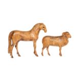 TWO HAND-CARVED WOODEN ANIMAL MODELS, c. 1930, a horse and a ram, each with glass eyes.