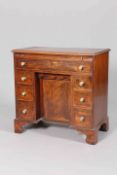 A GEORGE III MAHOGANY KNEEHOLE DRESSING TABLE, with slide and long frieze drawer,