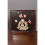 A REGIMENTAL EMBROIDERED TRAPUNTO, THE SUFFOLK REGIMENT, in a faux rosewood moulded frame.