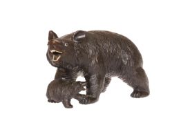 A BLACK FOREST CARVING OF A BEAR AND CUB, each modelled roaring and with glass eyes. Length 19.