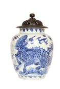 A CHINESE BLUE AND WHITE PORCELAIN JAR OF TRANSITIONAL TYPE, with pierced wooden cover,