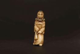 A JAPANESE CARVED HORN NETSUKE, PROBABLY LATE 18th/EARLY 19th CENTURY, of a Dutchman,