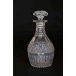 AN EARLY 19th CENTURY CUT-GLASS DECANTER, with scalloped stopper and stepped neck,