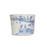 A CHINESE BLUE AND WHITE PORCELAIN BRUSH POT, cylindrical, painted with figures on a rocky shore.