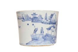 A CHINESE BLUE AND WHITE PORCELAIN BRUSH POT, cylindrical, painted with figures on a rocky shore.