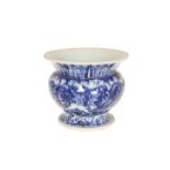 A CHINESE BLUE AND WHITE SPITTOON, the everted collar with stiff leaf decoration.
