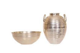 A SILVER VASE IN THE FORM OF A GREEK OLIVE JAR, the ribbed ovoid body with twin loop handles,