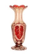 A BOHEMIAN CASED RUBY FLASH GLASS VASE, LATE 19th CENTURY, with scalloped flared rim,