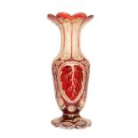 A BOHEMIAN CASED RUBY FLASH GLASS VASE, LATE 19th CENTURY, with scalloped flared rim,