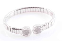 A DIAMOND SET BANGLE BY BULGARI,