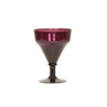 AN AMETHYST GLASS RUMMER, with shaped funnel bowl, knopped stem and circular foot.