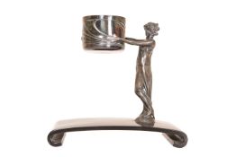 A CONTINENTAL SILVERED METAL FIGURAL HOLDER, c.