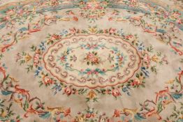 A CHINESE CARPET, oval, floral design.