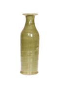 A GREEN CRACKLE-GLAZE POTTERY VASE IN ORIENTAL STYLE, the ribbed body of flask form,