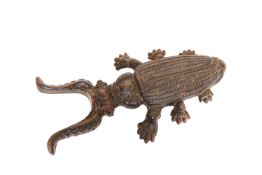 A CAST-IRON BOOT JACK, c. 1900, cast as a horned beetle.
