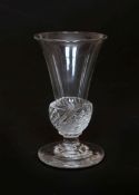 A LATE 18th CENTURY DRAM GLASS, the trumpet bowl with wrythen base, on a circular foot. 9.