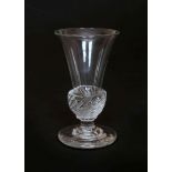 A LATE 18th CENTURY DRAM GLASS, the trumpet bowl with wrythen base, on a circular foot. 9.