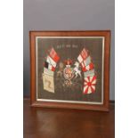 AN EMBROIDERED TRAPUNTO OF THE ROYAL COAT OF ARMS, in an oak frame.
