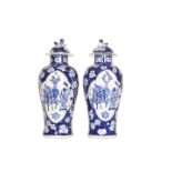 A PAIR OF CHINESE BLUE AND WHITE VASES AND COVERS, 19th Century,
