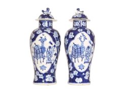 A PAIR OF CHINESE BLUE AND WHITE VASES AND COVERS, 19th Century,