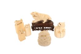 A GROUP OF FOUR CHINESE IVORY SEALS, c.