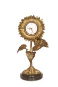 A FRENCH GILT-BRASS SUNFLOWER CLOCK, 19TH CENTURY, on marble plinth.