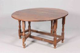 AN 18TH CENTURY OAK GATELEG TABLE, with block and baluster legs, raised on bun feet. 73.