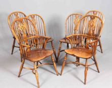 A SET OF SIX OAK AND ELM WINDSOR STYLE CHAIRS, including a pair of carvers,