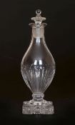 AN EARLY 19th CENTURY GLASS VINEGAR BOTTLE, of baluster shape, with flattened urn stopper,